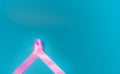 Pink ribbon On a blue background Conveys the awareness of cancer. World cancer day concept