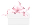 Pink ribbon bow on white gift box background Royalty Free Stock Photo
