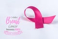 Pink ribbon on white paper background for supporting breast cancer Royalty Free Stock Photo