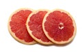 Pink ripe grapefruit slice on white isolated background. Half and slice of grapefruit isolated on white. Royalty Free Stock Photo