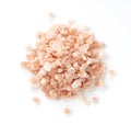 Pink rock salt placed on a white background