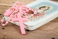 Pink rosary over a religious book