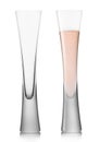 Pink rose champagne flutes glasses on white background. Full and empty glass for fine dinner Royalty Free Stock Photo