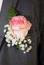 Pink rose flower on groom man suit in wedding day Royalty Free Stock Photo