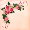 Pink rose flowers and ribbons corner arrangement on silk Royalty Free Stock Photo