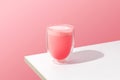 Pink rose milkshake in a transparent glass