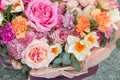 Beautiful elegant spring bouquet by florist with pink roses and narcissus close up, macro. Floral, flowers background Royalty Free Stock Photo