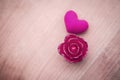 Pink rose and pink heart with space on sandstone Royalty Free Stock Photo