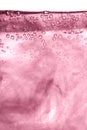 Pink water, air and oil mixed for a bubbly effect Royalty Free Stock Photo