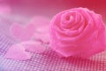 Pink rose and small hart on blue cloth background for Valentine