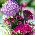 Flower bouquet in vibrant colors, beautiful arrangement with allium, celosia or cockscomb, lisianthus