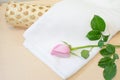 Pink rose and white towel on wood Royalty Free Stock Photo