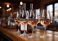 Pink rose wine glasses on large wooden table in winery vintage shop.Macro.AI Generative