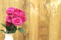 Pink roses against wooden background Royalty Free Stock Photo