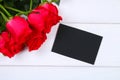 Pink roses with a blank chalkboard for text. Copy space for text. Template for March 8, Mother's Day, Valentine's Day. Royalty Free Stock Photo