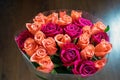 Background of peach and crimson roses. Beautiful coral roses, flowers bouquet close up. Bouquet of crimson and peach roses.