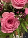 A pink roses bouquet with wax flowers