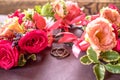 Pink roses buttonnierres and rings composition Royalty Free Stock Photo