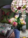 Pink Roses Beside Cabbage Rose Tiffany Lamp Royalty Free Stock Photo