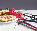 Pink roses, coffee, notebook, pensil and Belgium waffles