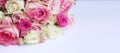 Pink roses in a festive bouquet on a white background. Delicate floral arrangement. Royalty Free Stock Photo