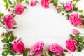 Pink Roses flat lay, floral composition on white wooden board, empty space for  text, concept for Wedding , St. Valentine`s Day, Royalty Free Stock Photo