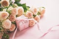 Pink roses flowers and gift or present box pink background. Mothers Day, Birthday, Valentines Day, Womens Day concept Royalty Free Stock Photo