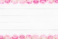 Pink roses frame on white wooden background. Mothers day, Valentines Day, Birthday celebration concept. Copy space, top view Royalty Free Stock Photo