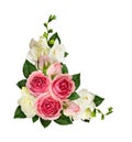 Pink roses and freesia flowers and buds in a corner arrangement Royalty Free Stock Photo