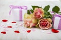 Pink roses, gift and hearts