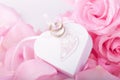 Pink roses and heart-shaped box wedding rings. gentle love background for valentines day