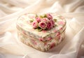 Pink Roses in Heart-Shaped Box on White Satin Fabric Royalty Free Stock Photo