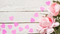 Pink roses and hearts on a white wooden table. Copy space for text. Template for March 8, Mother`s Day, Valentine`s Day. Banner Royalty Free Stock Photo