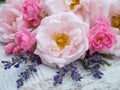 Pink roses and lavender bouquet on the rustic background Royalty Free Stock Photo