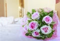 Pink roses of valentine flowers bouquet on white bed with copy s