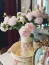 Pink roses in a vintage vase. Boudoir style Royalty Free Stock Photo