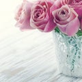 Pink roses in a white lace vase Royalty Free Stock Photo