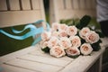 Pink roses on wooden bench Royalty Free Stock Photo