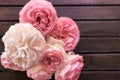 Pink roses on wooden dark background for a romantic look