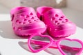 Pink rubber slippers,  on white background. Children`s rubber sandals isolated.Comfortable shoes for beach Royalty Free Stock Photo