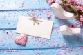 Pink sakura flowers, empty tag, heart and two white wooden deco Royalty Free Stock Photo