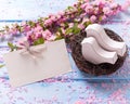 Pink sakura flowers, empty tag and two white wooden decorative Royalty Free Stock Photo