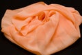 Pink, salmon silk tender colored textile, elegance rippled material Royalty Free Stock Photo