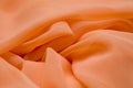 Pink, salmon silk tender colored textile, elegance rippled material Royalty Free Stock Photo