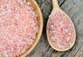 Pink salt in bamboo bowl on table