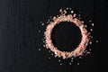 Pink salt on a black ceramic table