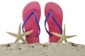 Pink sandal and starfishes on sand