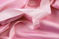 Pink satin silk background with ribbons