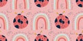 Pink scandinavian pattern with ladybird and rainbow. Seamless pattern with ladybug for spring. Boho scandinavian spring