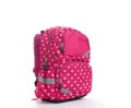 Pink school backpack with white dots isolated on white